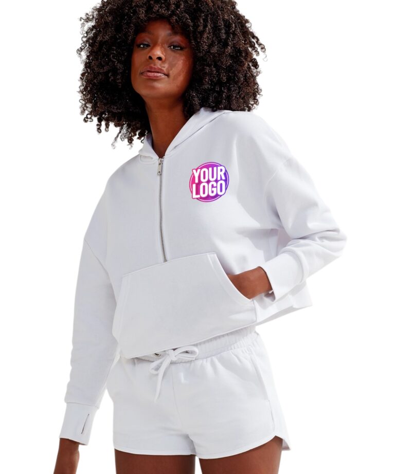a woman with curly hair wearing a white tracksuit